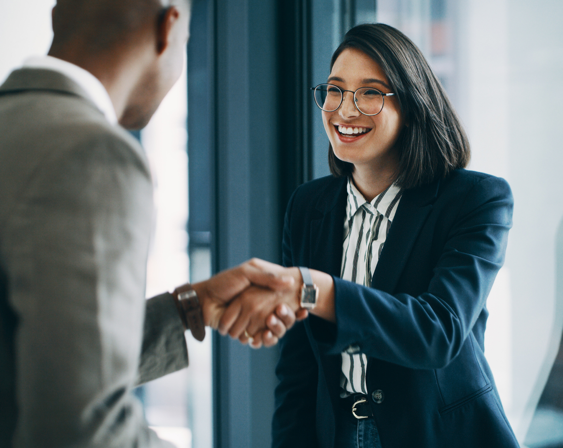 A man and woman shaking hands