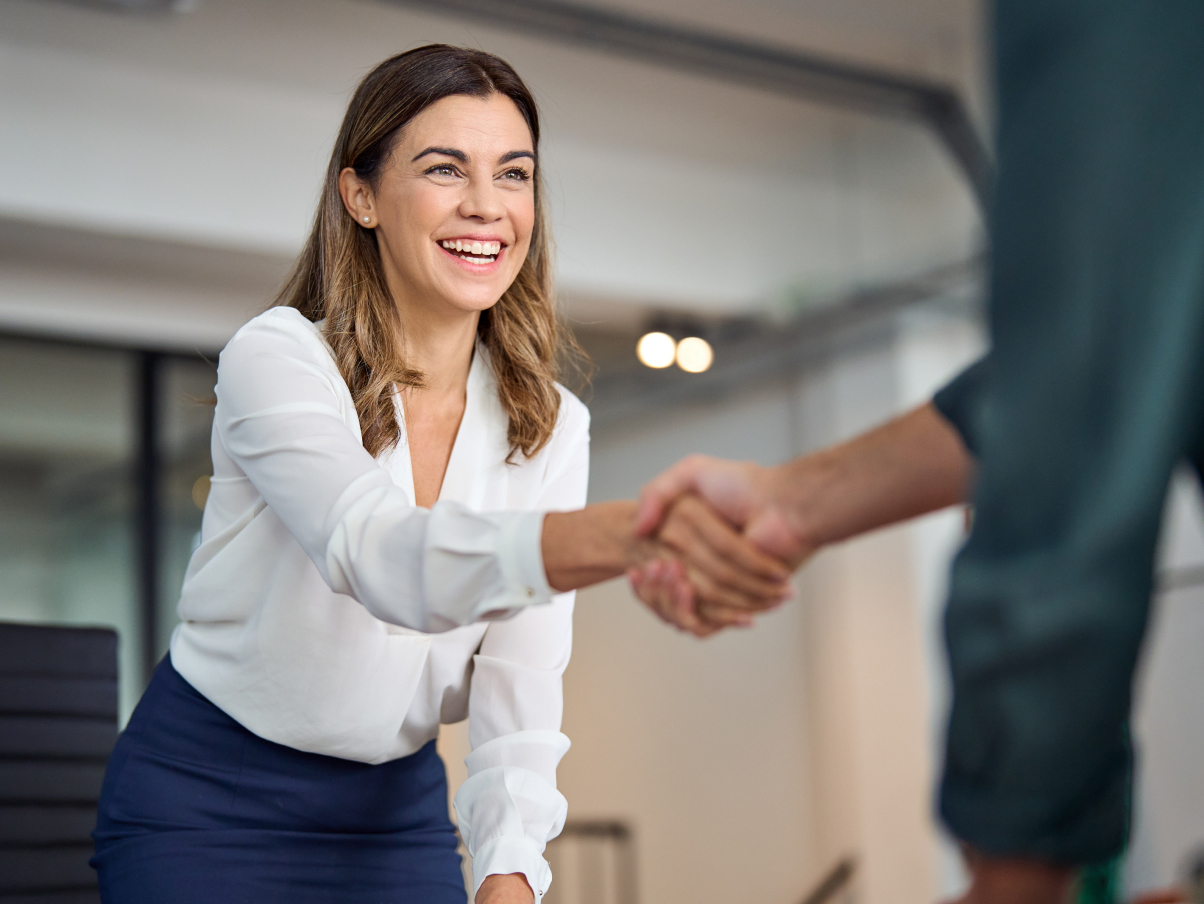 A woman shaking a hand