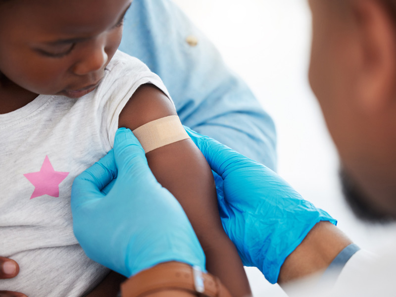 Senior patient receiving prep work for vaccines