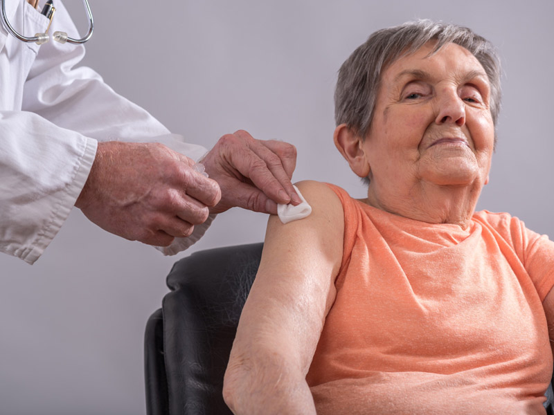 Senior patient receiving prep work for vaccines