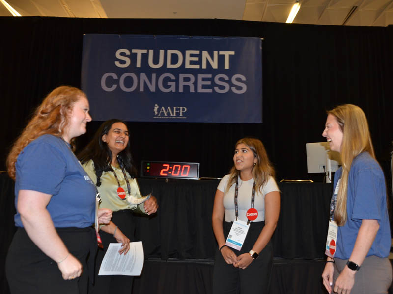 Alison Johnston (right), a fourth-year student from Penn State College of Medicine, shares a laugh with other candidates for student leadership positions during a break from the National Congress of Student Members. Johnston was elected FMIG Network national coordinator Aug. 3 in Kansas City, Mo. Samantha Bush (left), University of Wisconsin School of Medicine and Public Health, was elected student member of the STFM Board of Directors. Payal Morari (second from left) of the Kansas City University College of Osteopathic Medicine was elected student alternate delegate to the AAFP Congress of Delegates. Hirak Trivedi of Washington University of Health and Sciences is also pictured.