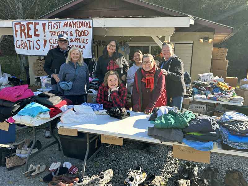  Shannon Dowler, M.D., C.P.E., FAAFP, center, paused for a photo at the first aid and emergency supply station