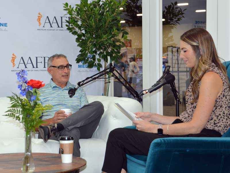 Frank Domino, M.D., talks with host Emily Holwick during a taping of the Inside Family Medicine podcast in the Xchange.