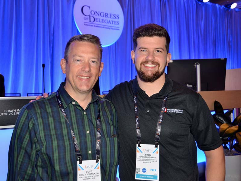 Boyd Southwick, D.O., left, pauses for a photo with his son Derek Southwick, M.D., during a break at the Congress of Delegates.